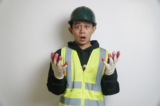 Surprised Construction Worker in Safety Vest and Hard Hat with Open Mouth