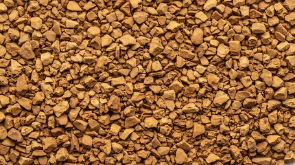 Naklejka premium Instant coffee granules close up view brown background texture.