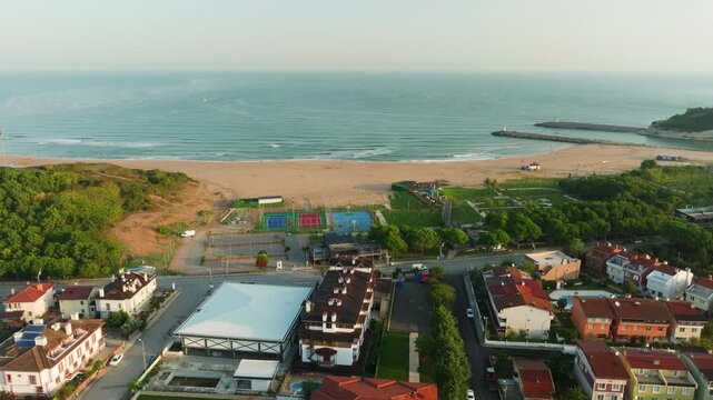 Aerial drone circles Agva Merkez beach without people at sunrise, September