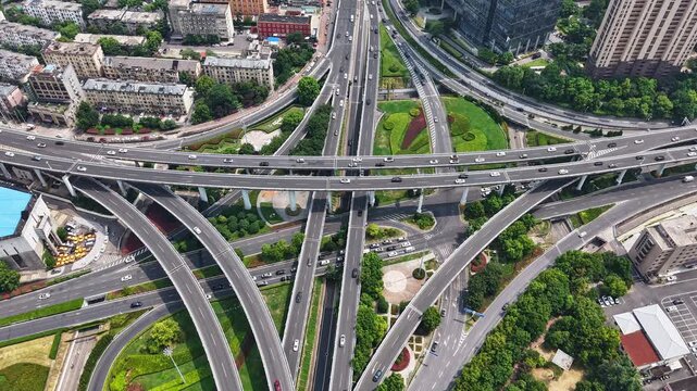 time-lapse,Top‑down aerial view of complex multi‑level urban highway interchange