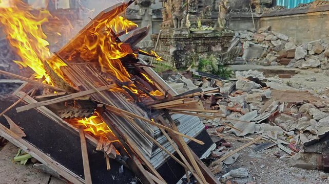 Burning Wooden Debris and Construction Trash outdoors at Renovation Site