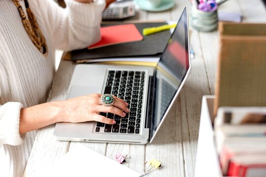 Woman working on laptop desk