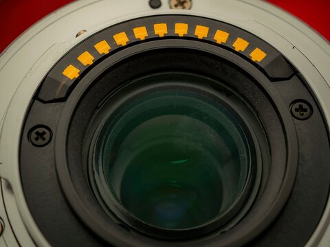 Macro close up of camera lens mount pins and electronic contacts detailing the precision engineering of photographic equipment