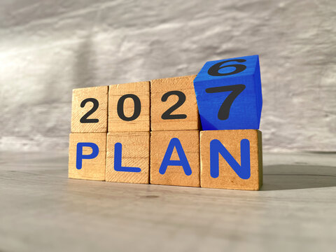 Wooden blocks displaying 2027 and PLAN, representing future planning, business goals, strategy and preparation for the year ahead.