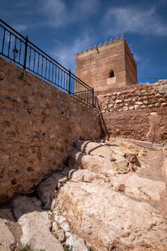 Medieval Tower of Homage of Aledo Castle, Region of Murcia, Spain, on a sunny day