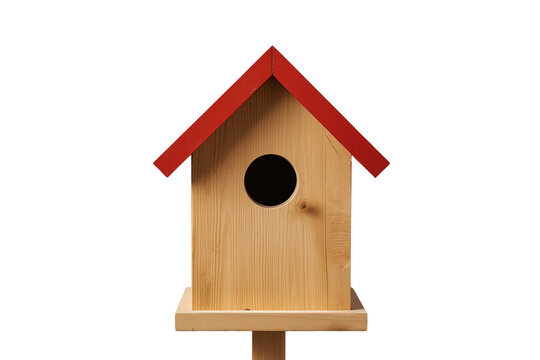 Simple wooden birdhouse with red peaked roof isolated