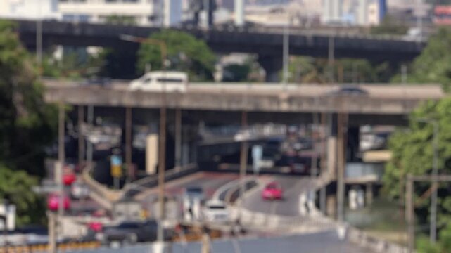 Bokeh view of road traffic in Bangkok, Thailand. Blurred background footage.