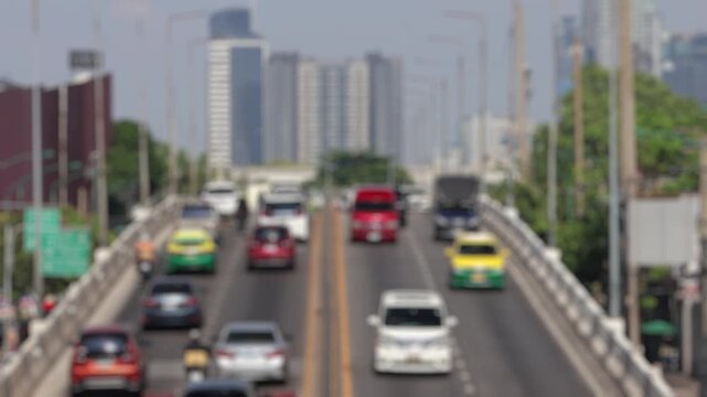 Bokeh view of road traffic in Bangkok, Thailand. Blurred background footage.