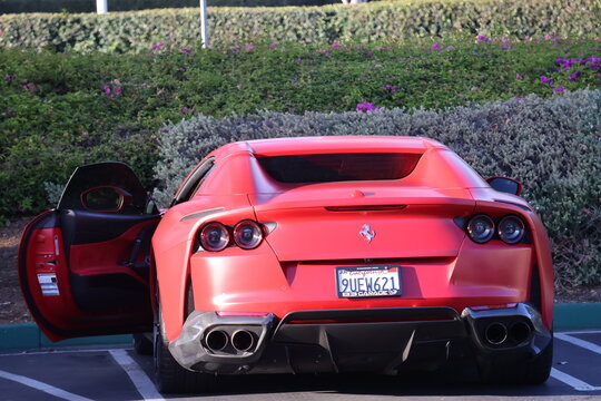 Monterey, California, USA - August 4, 2026: Red Ferrari 812 GTS convertible supercar parked 