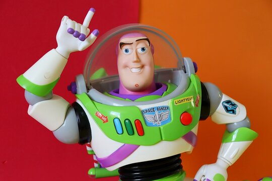 Salvador, Brazil - August 15, 2026: Buzz Lightyear action figure on a colorful background. Disney Pixar Toy Story character.