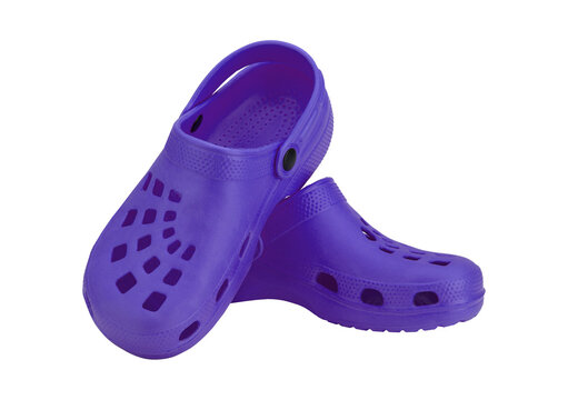 Pair of purple crocs for comfortable summer footwear with holes.