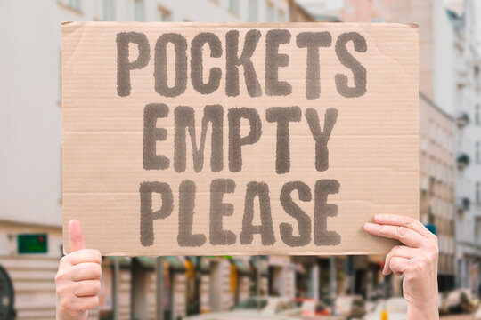 "Pockets Empty Please" The final purge before the metal arch. PURGE. METAL. ARCH. EMPTY. INSTRUCTION.