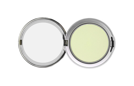 Open silver compact case with pale yellow color corrector disc.