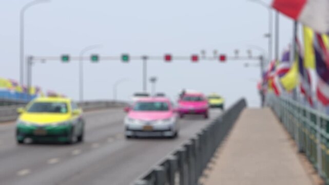 Bokeh view of road traffic in Bangkok, Thailand. Blurred background footage.