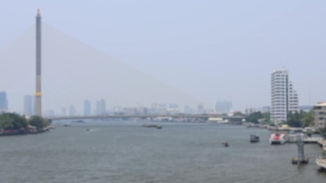 Bokeh view of ferry boats sailing on the Chao Phraya River, Bangkok, Thailand. Blurred background footage.
