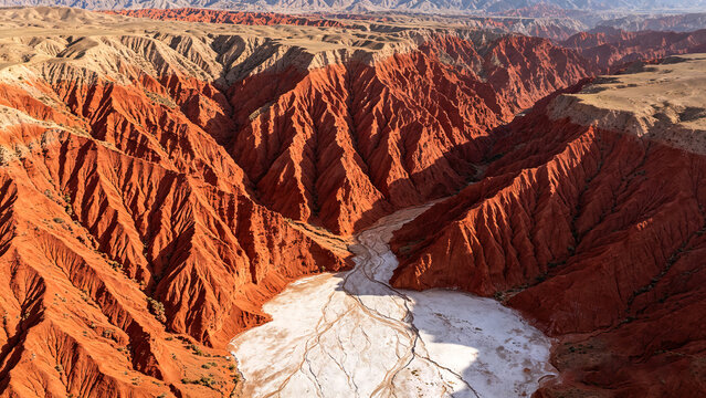Aerial Panorama Of Deep Red Eroded Canyon With Dry Salt Riverbed