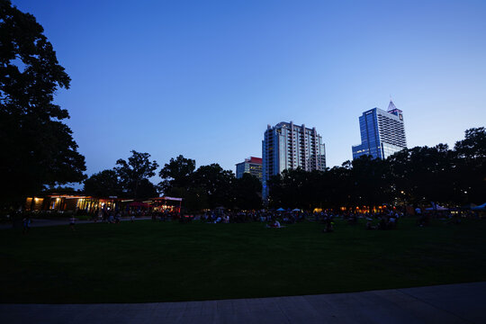 People enjoying an evening concert at Moore Square in downtown Raleigh, North Carolina