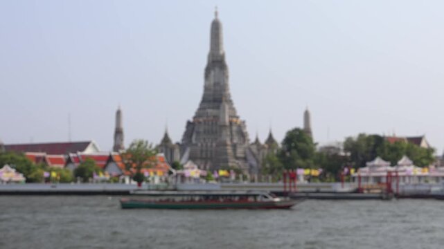 Bokeh view of ferry boats sailing on the Chao Phraya River, Bangkok, Thailand. Blurred background footage.