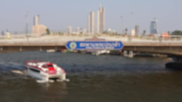 Bokeh view of ferry boats sailing on the Chao Phraya River, Bangkok, Thailand. Blurred background footage.