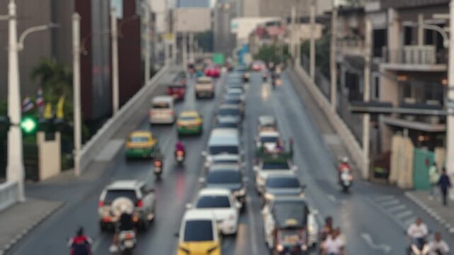 Bokeh view of road traffic in Bangkok, Thailand. Blurred background footage.