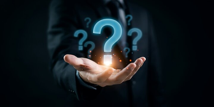 Businessman holding digital question mark icon for problem solving and business strategy