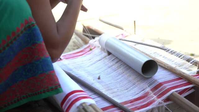Assamese Woman Weaving Traditional Handloom Textile by Hand