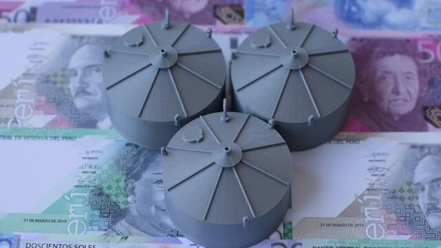 Liquefied gas storage tanks set against the Peruvian money as a background for your design