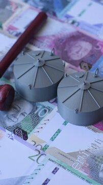 Liquefied gas storage tanks set against the Peruvian money as a background for your design