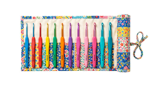 Colorful crochet hook set in floral fabric case on white background