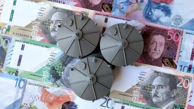 Liquefied gas storage tanks set against the Peruvian money as a background for your design
