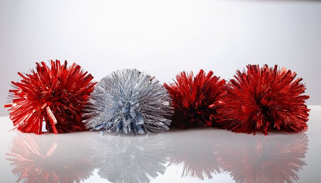 cheer pom pom resting arranged on white studio background