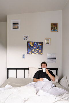 UGC Man drinking coffee in bed during quiet morning at home