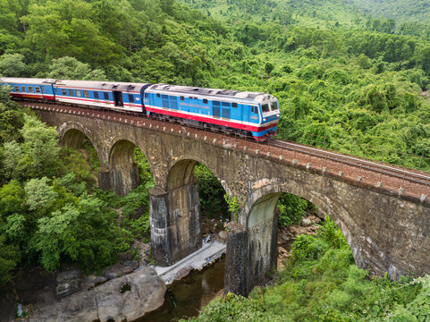 Train crossing stone viaduct at Hai Van Pass, Vietnam