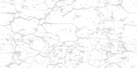 Fototapeta premium Cracked white wall texture with subtle grey lines during bright daylight for distressed backgrounds