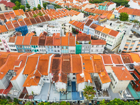 Colorful congested row houses with terracotta tiled roofs