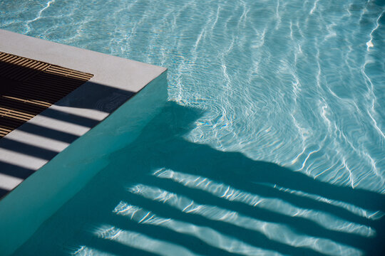 Shadows Falling Across Clear Swimming Pool Water