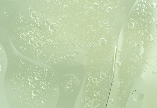 Abstract Green water bubbles essential oil beauty collagen Serum Repair cell background.