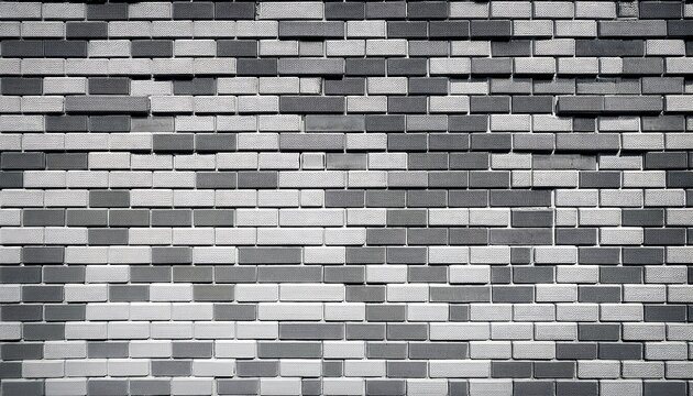 gray and white brick wall textured surface with interlocking rectangular blocks arranged in a consistent pattern
