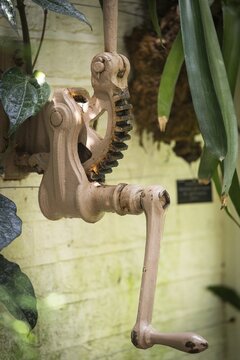 Device with gear and crank to open and close windows in Tropical Corridor, a hot, humid greenhouse that simulates a tropical habitat, Chelsea Physic Garden, historic botanical garden, oldest botanical garden in London, founded in 1673 by the Worshipful Society of Apothecaries, Chelsea, England, Great Britain
