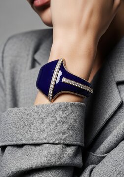 dark blue enamel and diamond cuff bracelet on a woman arm