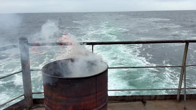 drum garbage burn vessel at sea underway.