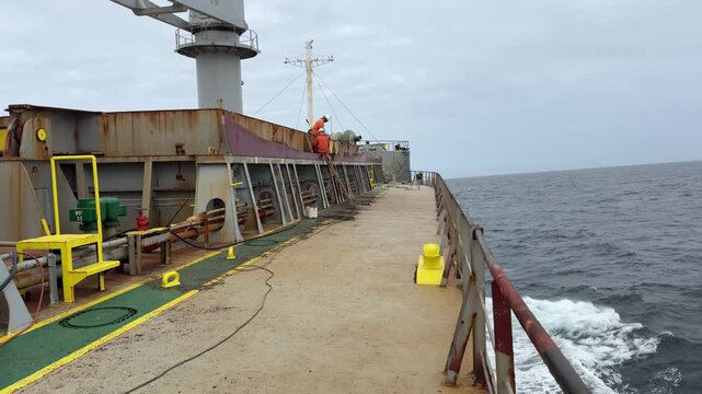 deck works on board the ship at sea.