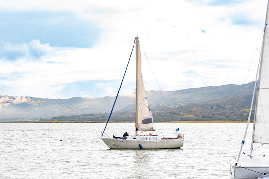 Sailboat Floating on Scenic Mountain Lake