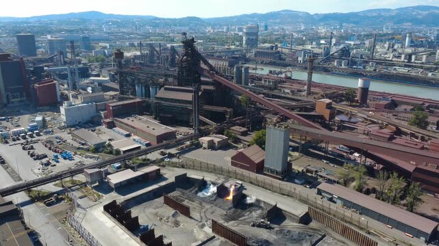 Slag pot carrier tips molten slag into a pit below the blast furnace at a steelworks