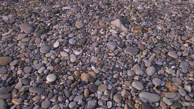 Devghat Dham Sacred Riverbank in Nepal, Smooth River Stones and Pebbles on Natural Riverside, Peaceful Hindu Pilgrimage Site, Nature and Spiritual Travel