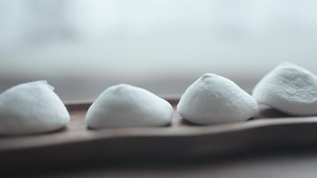 Close-up of chocolate covered marshmallow with soft texture