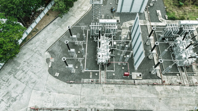 Aerial view of the electrical substation in Tharamani, featuring high-voltage transformers, switchgear, and concrete pathways in Chennai, Tamil Nadu, India.