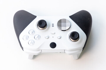 Modern White Gaming Controller with Black Grips on White Background © YouraPechkin