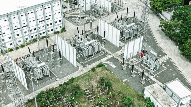 Aerial view of the Tharamani electrical substation featuring large power transformers, high-voltage equipment, and concrete barriers in Chennai, Tamil Nadu, India.