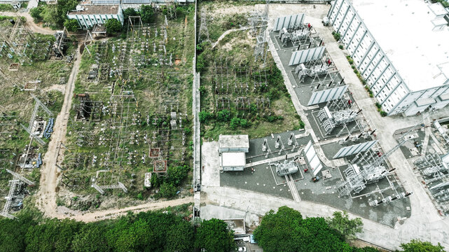 Aerial view of the electrical substation in Tharamani with transformers, power lines, and industrial infrastructure surrounded by greenery in Chennai, Tamil Nadu, India.